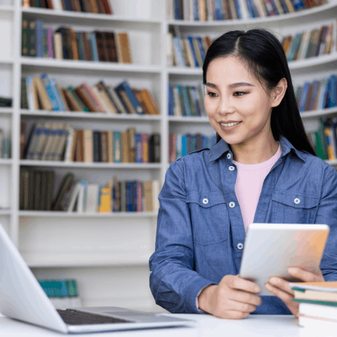 A reviewer compares research tables side by side as Translation Services in Burien certify academic document translations.
