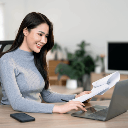 A client organizes certified immigration forms, using Russian Translation Services in Washington for accurate filing needs.