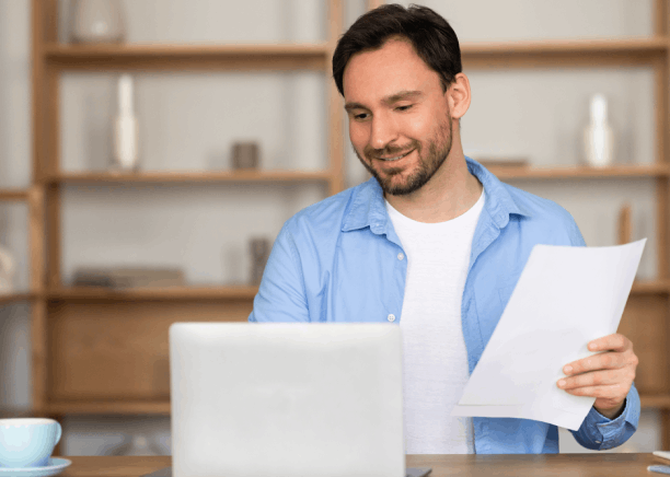 A client compares Mandarin and English contract pages as Translation Services in Bellevue provide real estate translations.