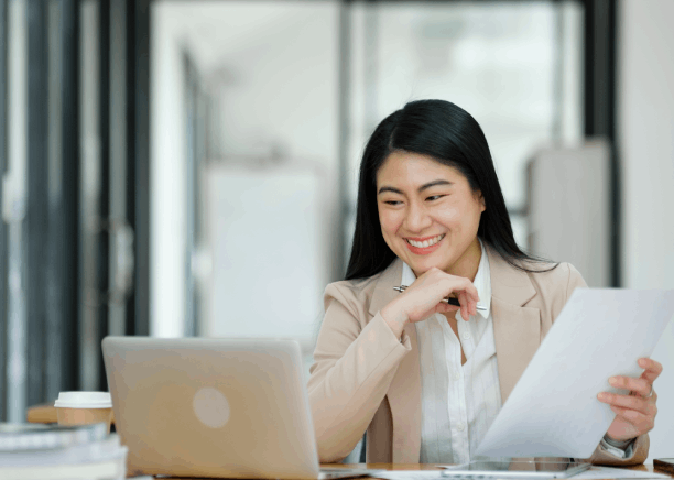 A staff member reviews a translated client email as Translation Services in Bellevue keep communication accurate and polite.