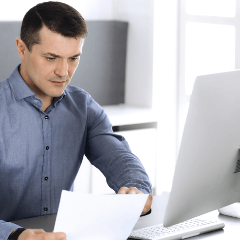 A compliance officer compares legal filings, using Translation Services in Bellevue for government agencies and audits.