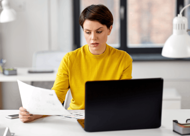 A client reviews a certified marriage certificate translation as Translation Services in Burien finalize names and dates.