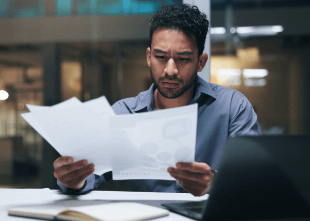 A finance manager reviews a certified contract as Translation Services in Kirkland prepare business-ready files for signing.