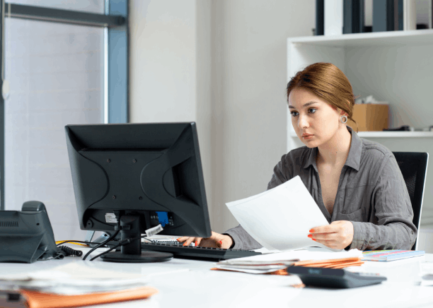 A manager compares certified contract pages, relying on Translation Services in Bellevue to support business compliance.