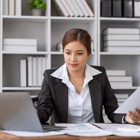 A certified translator checks a property purchase contract, using Translation Services in Seattle for real estate closings.