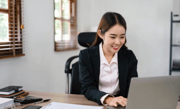 A translator works on a secure laptop as Translation Services in Kirkland handle certified documents under confidentiality.