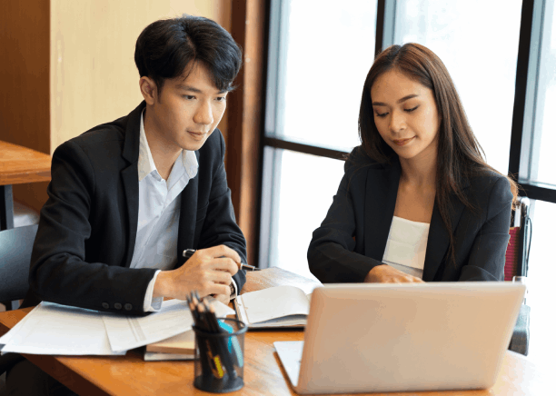 A paralegal prepares a court filing with Vietnamese Translation Services in Washington, checking legal terms line by line.