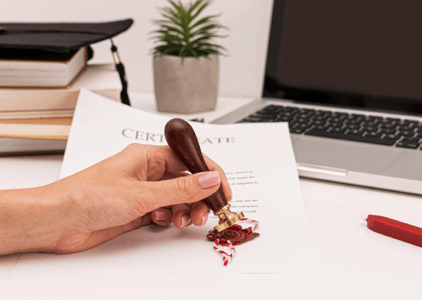 A translator stamps a certification page as Translation Services in Redmond finalize real estate documents for filing.