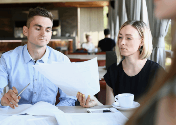 A project manager checks layout on a real estate contract while Russian Translation Services in Washington keeps formatting.