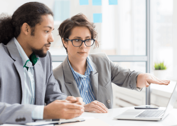 Two reviewers use Translation Services in Seattle for accurate document translations, cross-checking a bilingual contract.