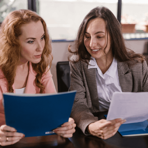A paralegal checks a certified contract translation in a case binder, using Translation Services in Seattle for legal use.