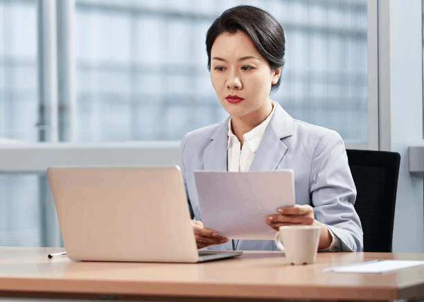 A translator prepares USCIS filing translations for Translation Services in Renton, aligning pages and verifying terminology.