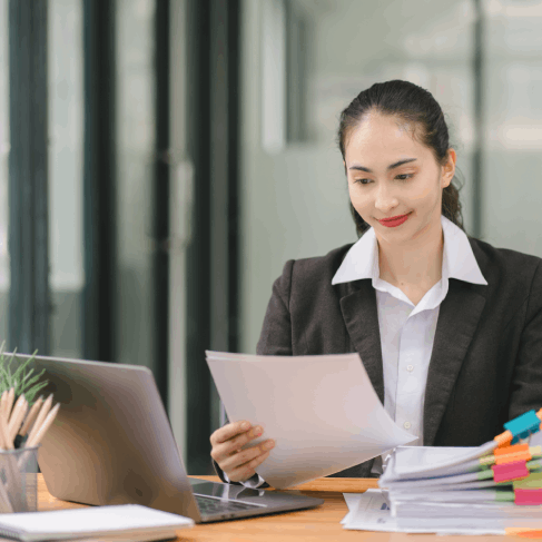 A translator compares supporting legal documents to a USCIS checklist, using Translation Services in Seattle for immigration.
