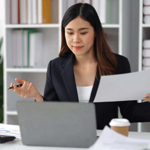 A certified translator compares a diploma to its English version as Spanish Translation Services in Washington finalize it.