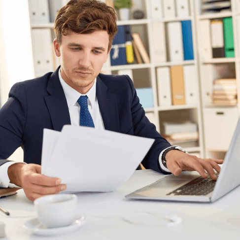 A translator compares a contract and glossary as Spanish Translation Services in Washington ensure precise legal terms.
